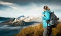 Young woman backpacker enjoying view volcano Bromo Royalty Free Stock Photo