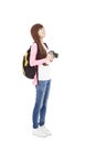 Young woman backpacker holding a camera