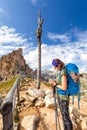 Backpacker woman tourist standing Forcella Cier mountain pass Italy Royalty Free Stock Photo