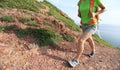 Young woman backpacker walking on seaside mountain