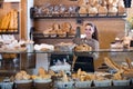 Young woman at bakery display Royalty Free Stock Photo