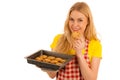 Young woman baking cookies isolated over white background Royalty Free Stock Photo