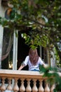 Young woman on the balcony of the old palace Royalty Free Stock Photo