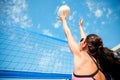 Young woman with ball playing volleyball on beach Royalty Free Stock Photo