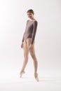 Young woman ballet dancer on pointe in the studio