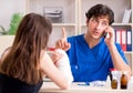 Young woman with bandaged arm visiting male doctor traumotologis Royalty Free Stock Photo