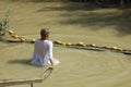 Young Woman at the Baptism Site in Jordan River. Israel Royalty Free Stock Photo