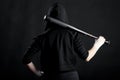 Young woman with a baseball bat. View from the back. hoodlum Royalty Free Stock Photo