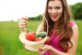 Young woman with basket of vegetables Royalty Free Stock Photo