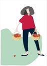 Young woman with baskets of strawberries. Harvesting concept. Agritourism concept