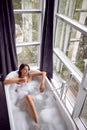 Woman in bath drink champagne and relaxing top view Royalty Free Stock Photo
