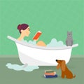 Young woman in bath tub reading a book Royalty Free Stock Photo