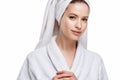 Young woman in a bathrobe and towel on her head, spa and care portrait, clean natural face