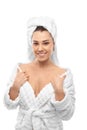 Young woman in a bathrobe and towel on her head Royalty Free Stock Photo