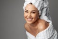 Young woman in a bathrobe and towel on her head Royalty Free Stock Photo