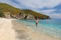 Young woman at the beach Kalamos in Evia island, Greece