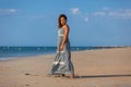 YOUNG WOMAN ON A BEACH