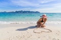 Young Woman On Beach Summer Vacation, Girl Draw Heart Shape Lying Sand Seaside