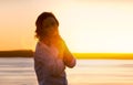 Young woman on beach at sunset Royalty Free Stock Photo