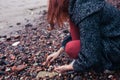 Young woman beachcombing in city