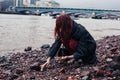 Young woman beachcombing in city