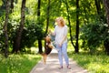 Young woman with Beagle dog in the summer park Royalty Free Stock Photo