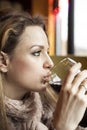 Young Woman with Beautiful Blue Eyes Drinking Red Wine Royalty Free Stock Photo