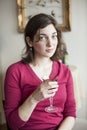Young Woman with Beautiful Green Eyes Drinking Wine Royalty Free Stock Photo