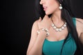 Young woman with beautiful jewelry on black background Royalty Free Stock Photo