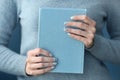 Young woman with beautiful manicure holding notebook, closeup Royalty Free Stock Photo