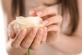 Young woman with beautiful manicure holding rose, closeup Royalty Free Stock Photo