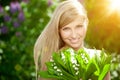 Young woman with a beautiful smile with healthy teeth with flowers. Face of a beautiful positive girl Concept on the subject Royalty Free Stock Photo