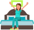 Girl stretching after sleep in bedroom. Cheerfully lady in morning. Woman yawns and wakes up