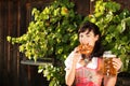 Young woman with beer glasses and bretzel Royalty Free Stock Photo