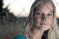 young woman behind a fence Royalty Free Stock Photo