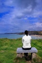 Young woman on bench Royalty Free Stock Photo