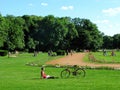 Young woman, bicycle, public park, Margaret island, Budapest Royalty Free Stock Photo