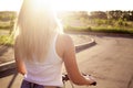 Young woman on bicycle in sunlight Royalty Free Stock Photo