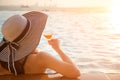 Young woman in big hat relaxing on the swimming pool, Royalty Free Stock Photo