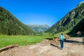 Schladming - A girl hiking through an alpine meadow Royalty Free Stock Photo