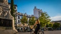 A young woman on a bike at Barrio de La Letras downtown Madrid, Spain