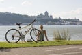 Young Woman with Bike outside with quebec view Royalty Free Stock Photo