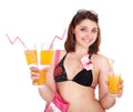 Young woman in bikini with coctail.