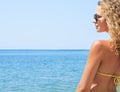 Young woman in a bikini enjoying the ocean breezes Royalty Free Stock Photo