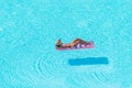 Young woman in bikini air mattress in the big swimming pool Royalty Free Stock Photo