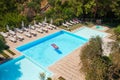 Young woman in bikini air mattress in the big swimming pool Royalty Free Stock Photo