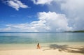Young woman in bikini sitting on a tropical beach, Nananu-i-Ra i Royalty Free Stock Photo