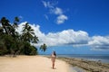 Young woman in bikini standing on the beach of Makaha`a island n Royalty Free Stock Photo