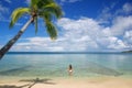 Young woman in bikini standing in clear water, Nananu-i-Ra island, Fiji Royalty Free Stock Photo