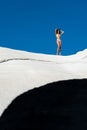 Young woman in a bikini standing on the rocky beach of Sarakiniko on the Greek island of Milos Royalty Free Stock Photo